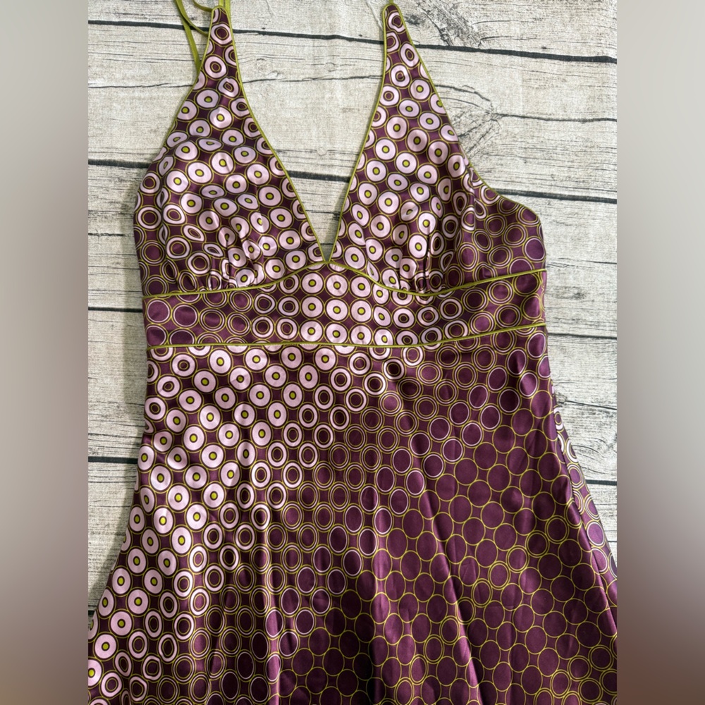 NWOT! 100% silk. BCBG stunning backless asymmetrical length dress. Size 12. New
